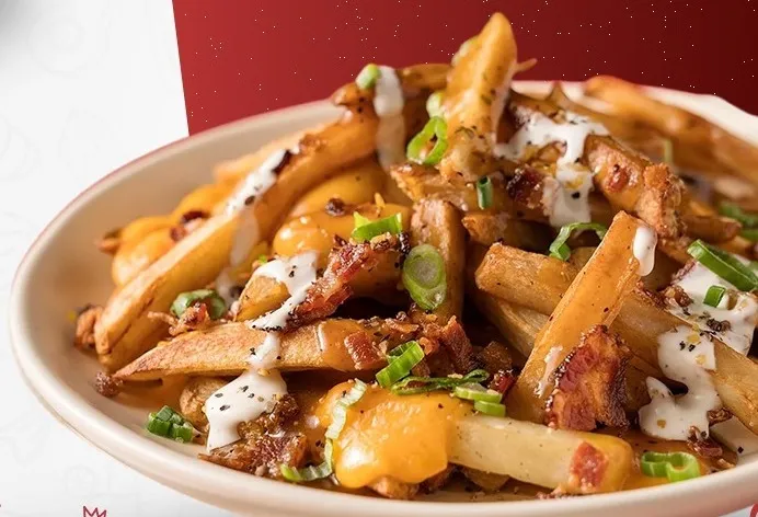 Delicious butter chicken poutine in Edmonton, AB